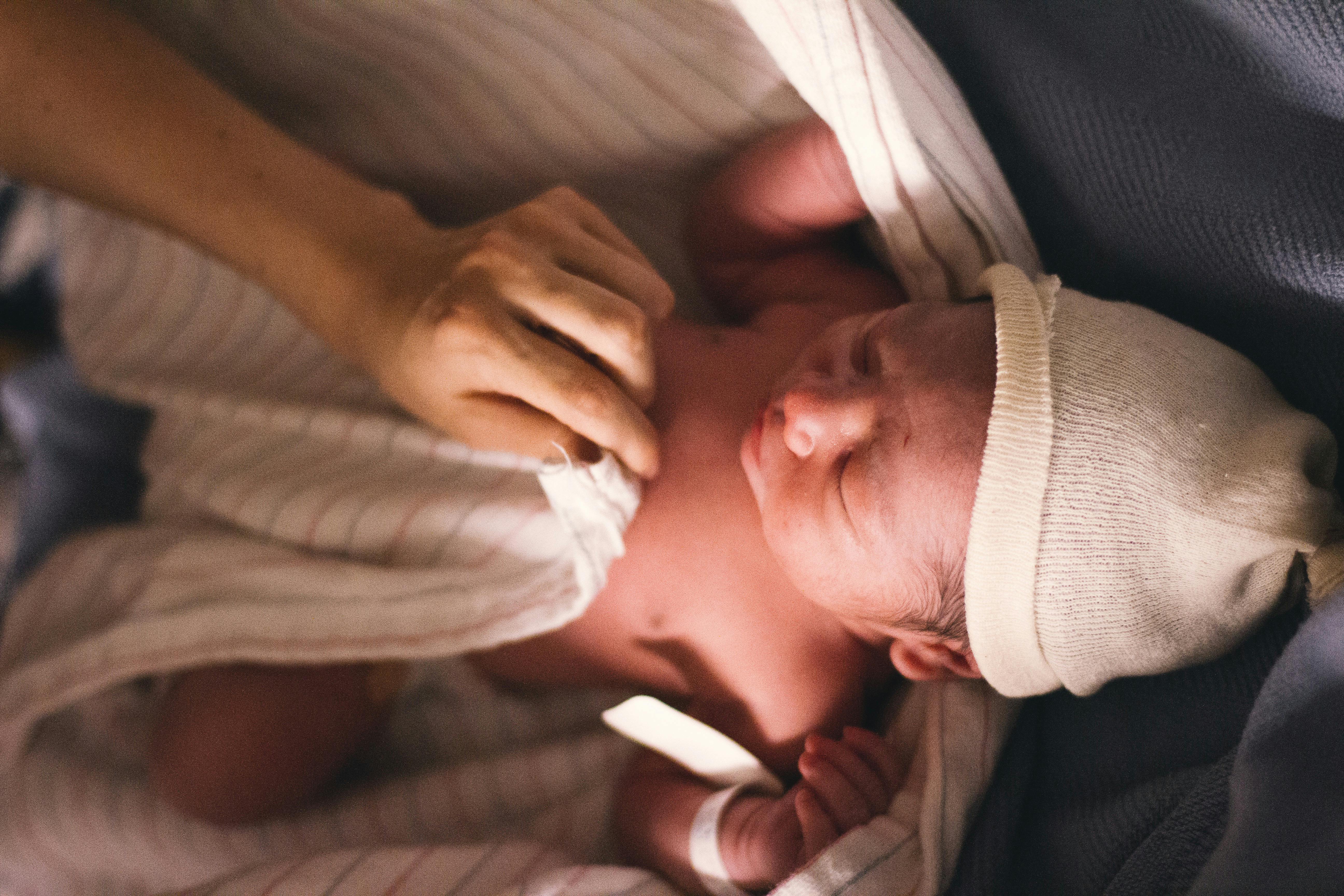 swaddled newborn infant