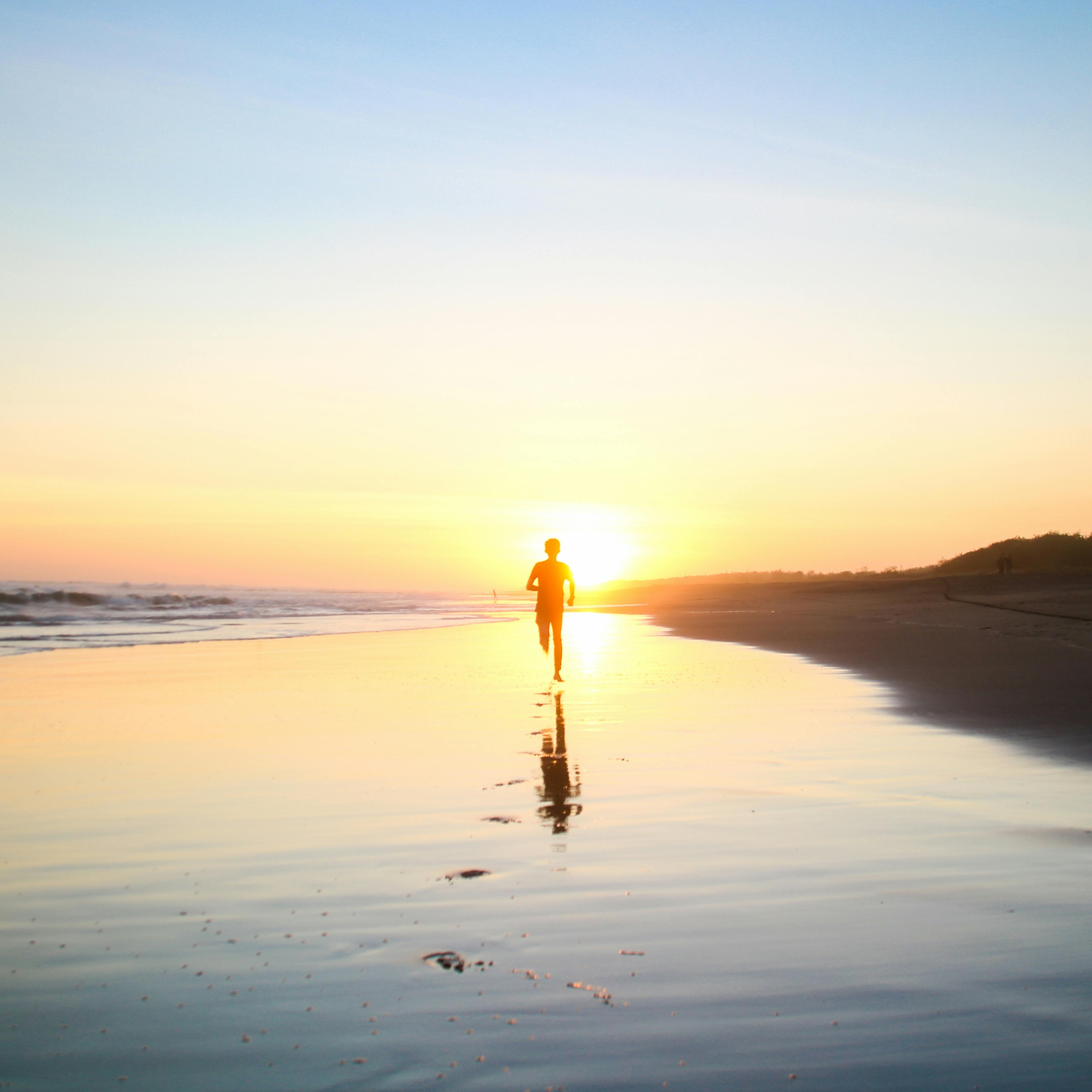 person running on a beach