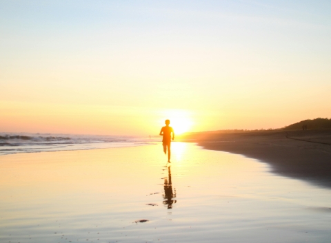 person running on a beach