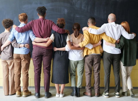 Diverse group of young adults standing together.