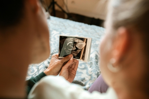 Parents Holding MRI scan of their baby